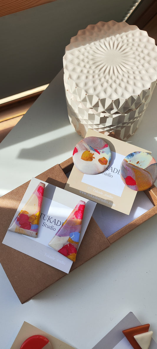 NOAH maxi y CÁNDIDA degradado multicolor.